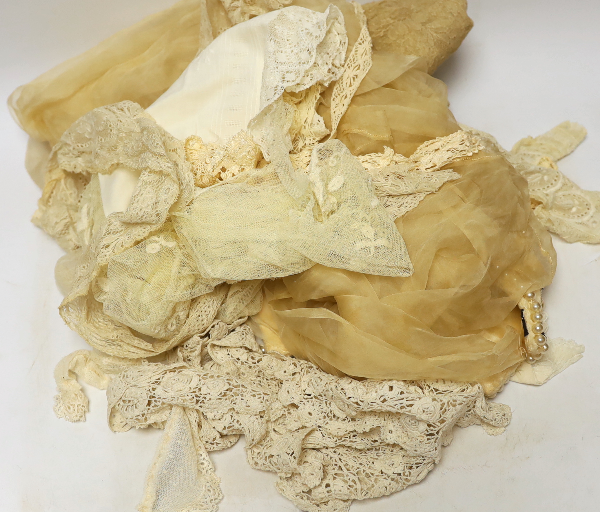 An Edwardian fine machine lace stole and various handmade and machine lace collars and trimmings, with a wedding veil from 1920's and pearl and diamonté head-dress